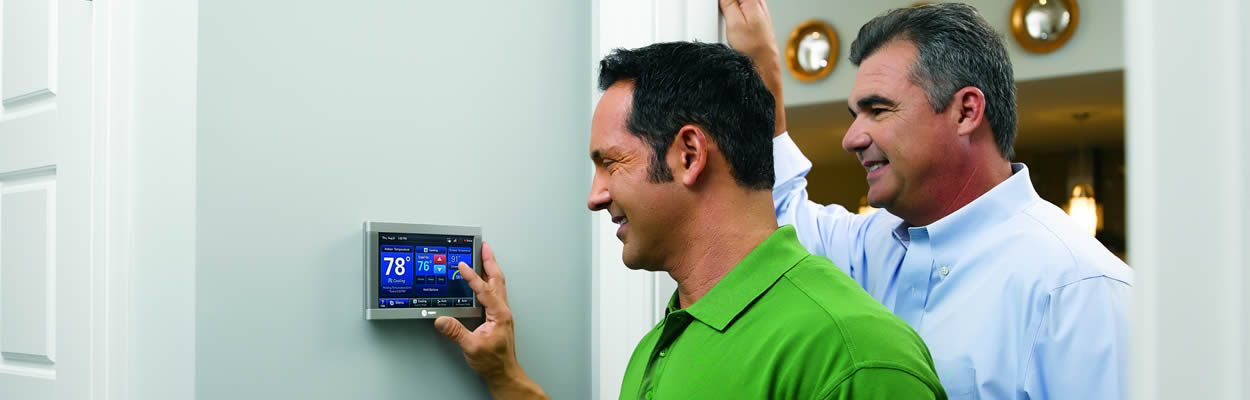 Tech Showing Customer How To Use Smart Thermostat